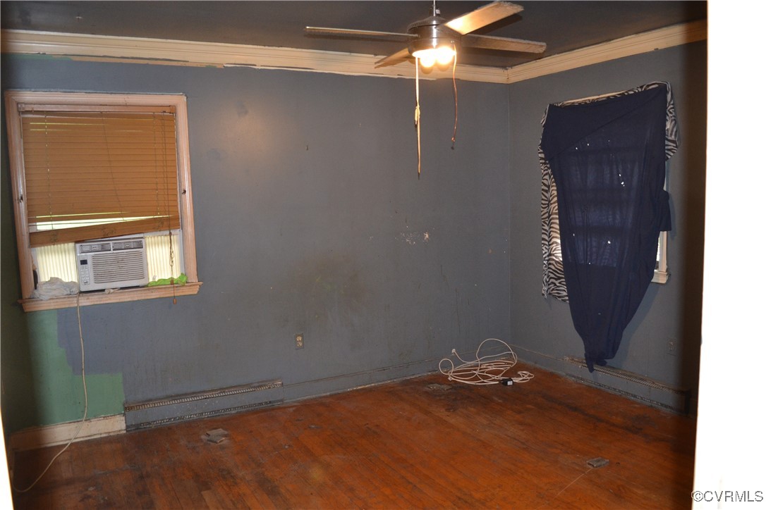 5109 West Hundred Road Chester, VA 23831 - Photo 16 of 34 a view of a livingroom with a ceiling fan and window