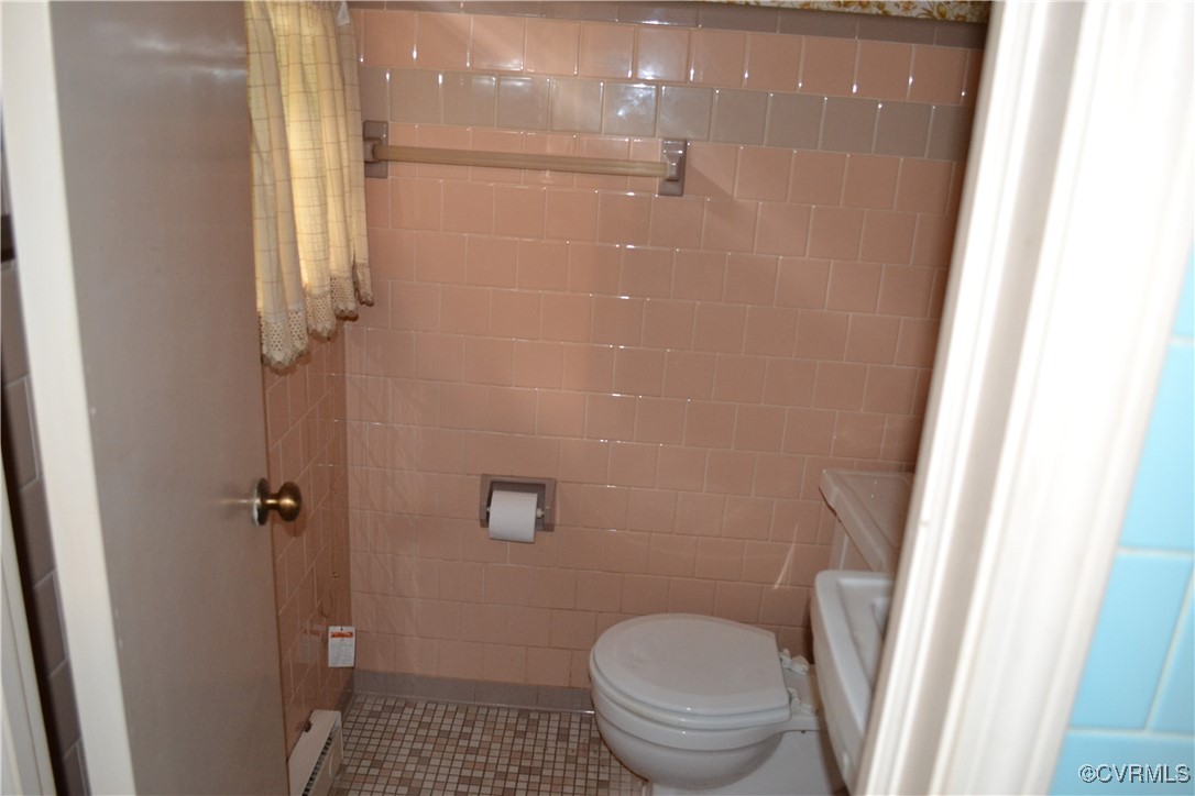 5109 West Hundred Road Chester, VA 23831 - Photo 19 of 34 a bathroom with a granite countertop toilet and a shower
