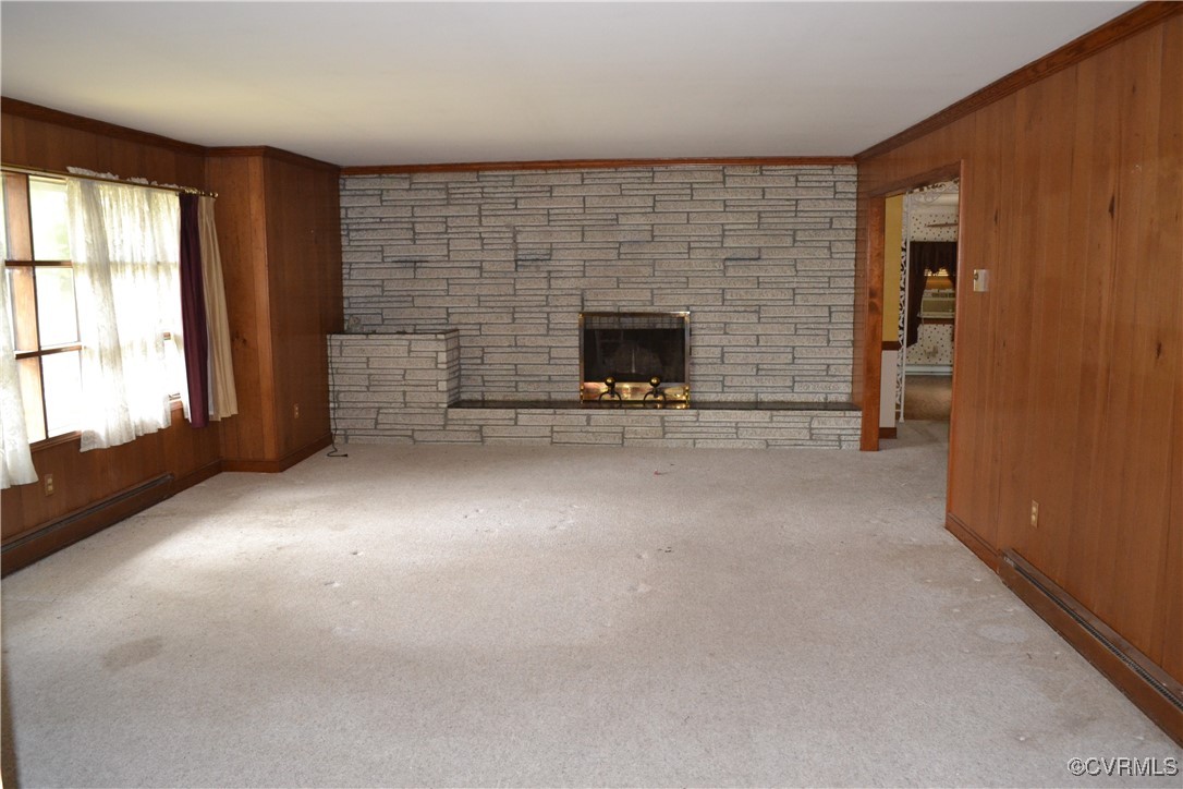 5109 West Hundred Road Chester, VA 23831 - Photo 2 of 34 an empty room with a fireplace and windows