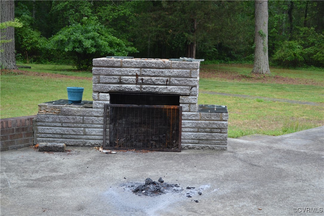 5109 West Hundred Road Chester, VA 23831 - Photo 32 of 34 a view of a deck with a fireplace and wooden floor