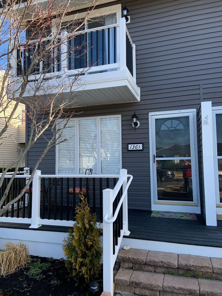 136 44th Street South, Unit A Brigantine, NJ 08203 - Photo 1 of 19 a front view of a house with entryway