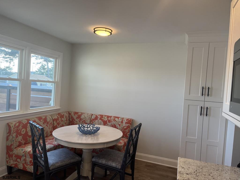 136 44th Street South, Unit A Brigantine, NJ 08203 - Photo 15 of 19 a view of a dining room with furniture and window