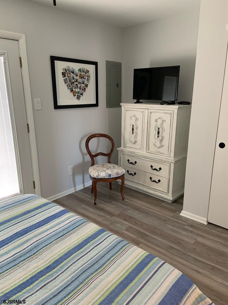 136 44th Street South, Unit A Brigantine, NJ 08203 - Photo 17 of 19 a living room with furniture and a flat screen tv