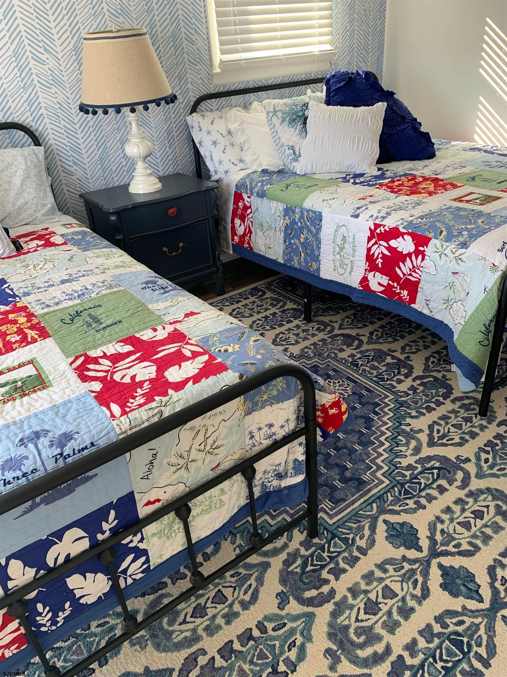 136 44th Street South, Unit A Brigantine, NJ 08203 - Photo 3 of 19 a bed room with a bed and a couch