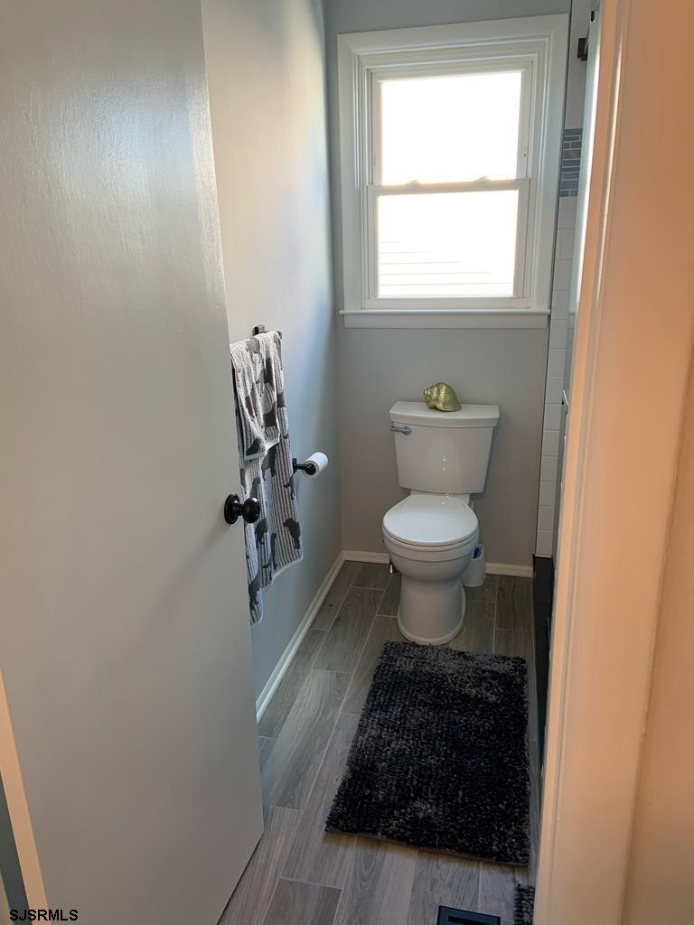 136 44th Street South, Unit A Brigantine, NJ 08203 - Photo 4 of 19 a bathroom with a toilet and a sink