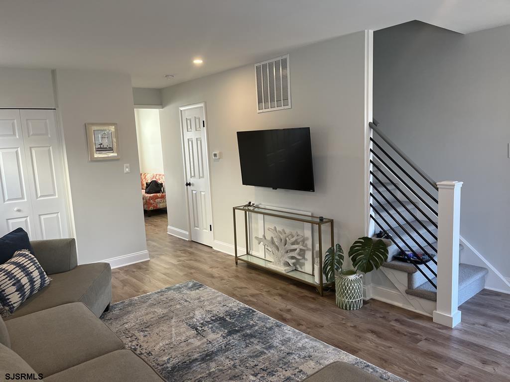 136 44th Street South, Unit A Brigantine, NJ 08203 - Photo 8 of 19 a living room with furniture and a flat screen tv