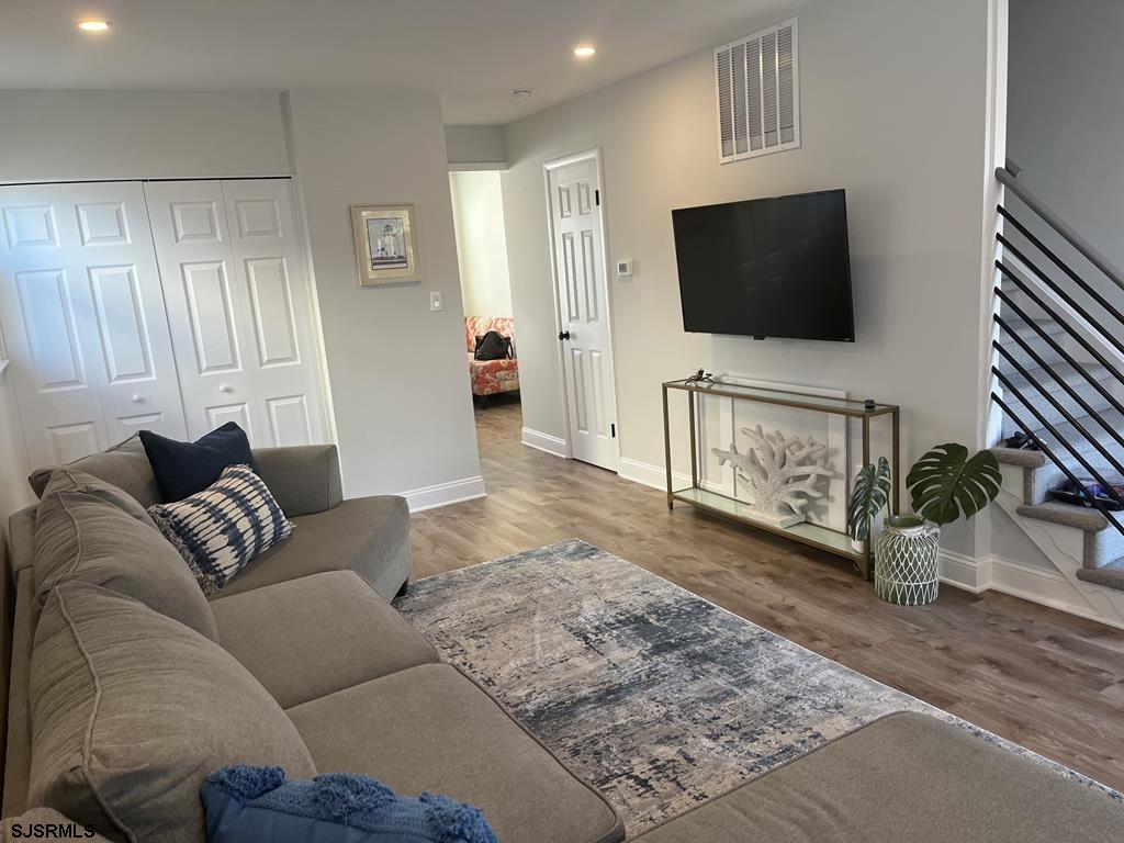 136 44th Street South, Unit A Brigantine, NJ 08203 - Photo 10 of 19 a living room with furniture and a flat screen tv