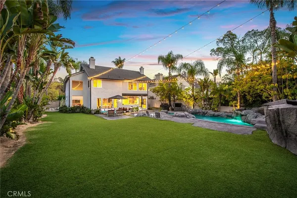 a view of a patio with couches and a fire pit