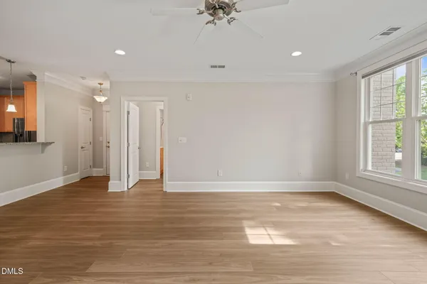 a view of an empty room with a window