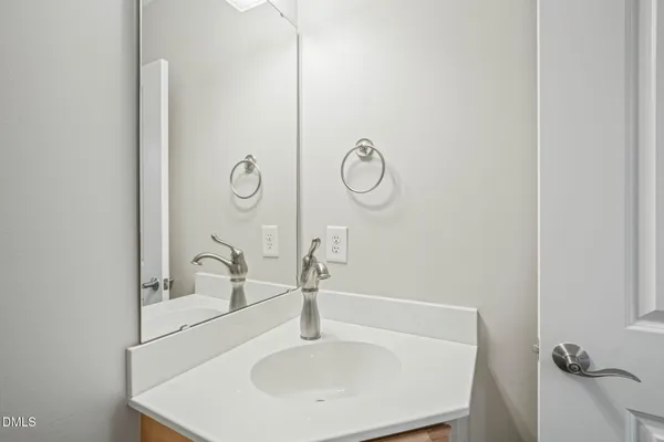 a bathroom with a sink and mirror