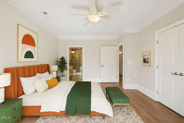 a bedroom with a bed and a painting on the wall