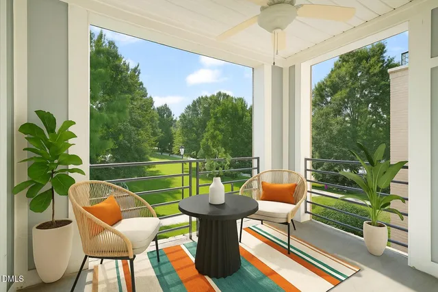 a view of a chairs and table in patio with a potted plant
