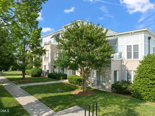 a view of a building with a yard