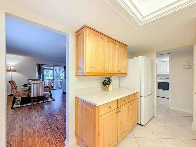 a kitchen with a stove a sink and cabinets