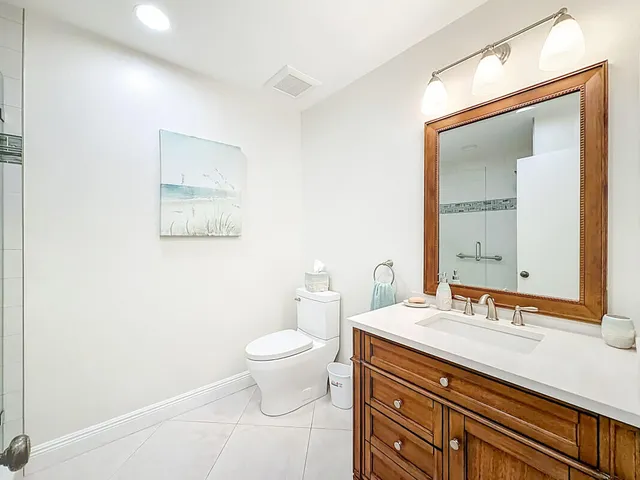 a bedroom with a bed and large window