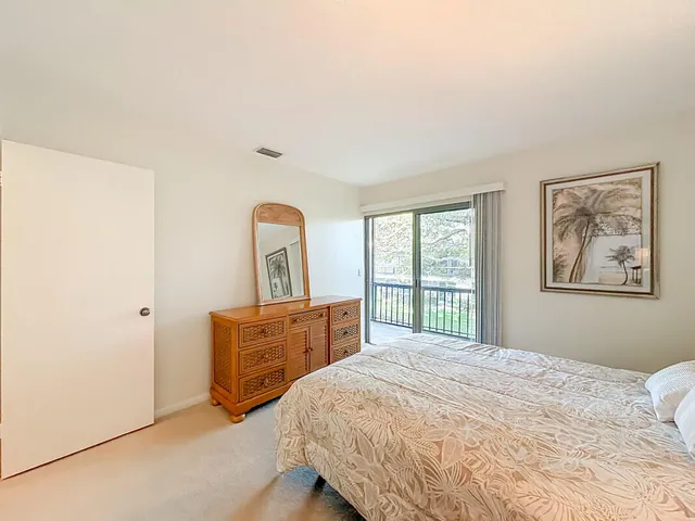 a bedroom with two beds and a window