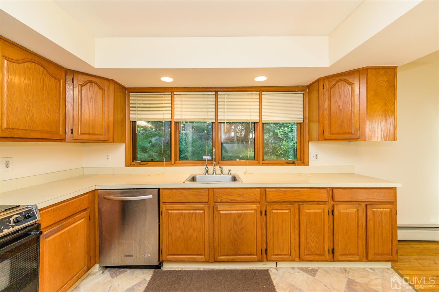 58 Forest Road Andover, NJ 07821 - Photo 14 of 34 a kitchen with a sink and cabinets