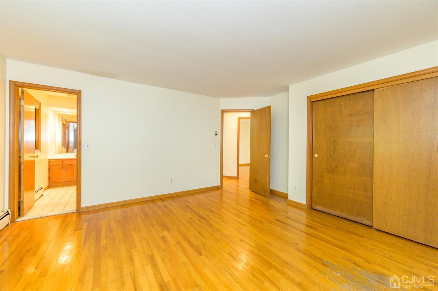 58 Forest Road Andover, NJ 07821 - Photo 18 of 34 a view of an empty room with wooden floor