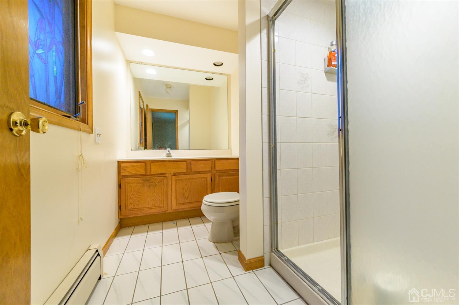 58 Forest Road Andover, NJ 07821 - Photo 19 of 34 a bathroom with a granite countertop toilet and a sink