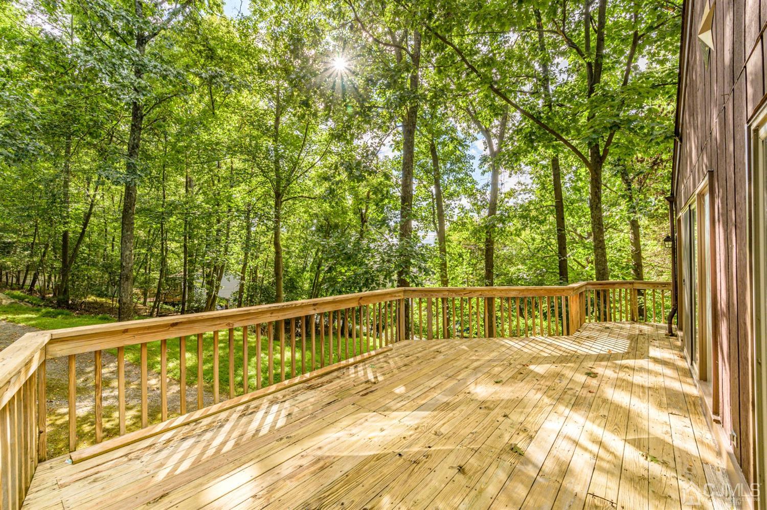 58 Forest Road Andover, NJ 07821 - Photo 26 of 34 a view of swimming pool with trees in the background