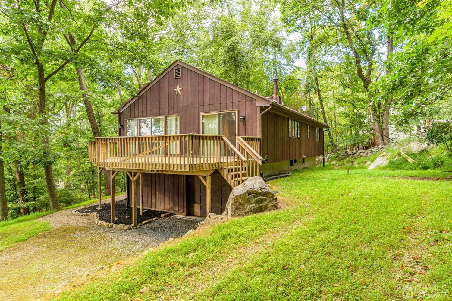 58 Forest Road Andover, NJ 07821 - Photo 29 of 34 a view of a house with a yard and large tree