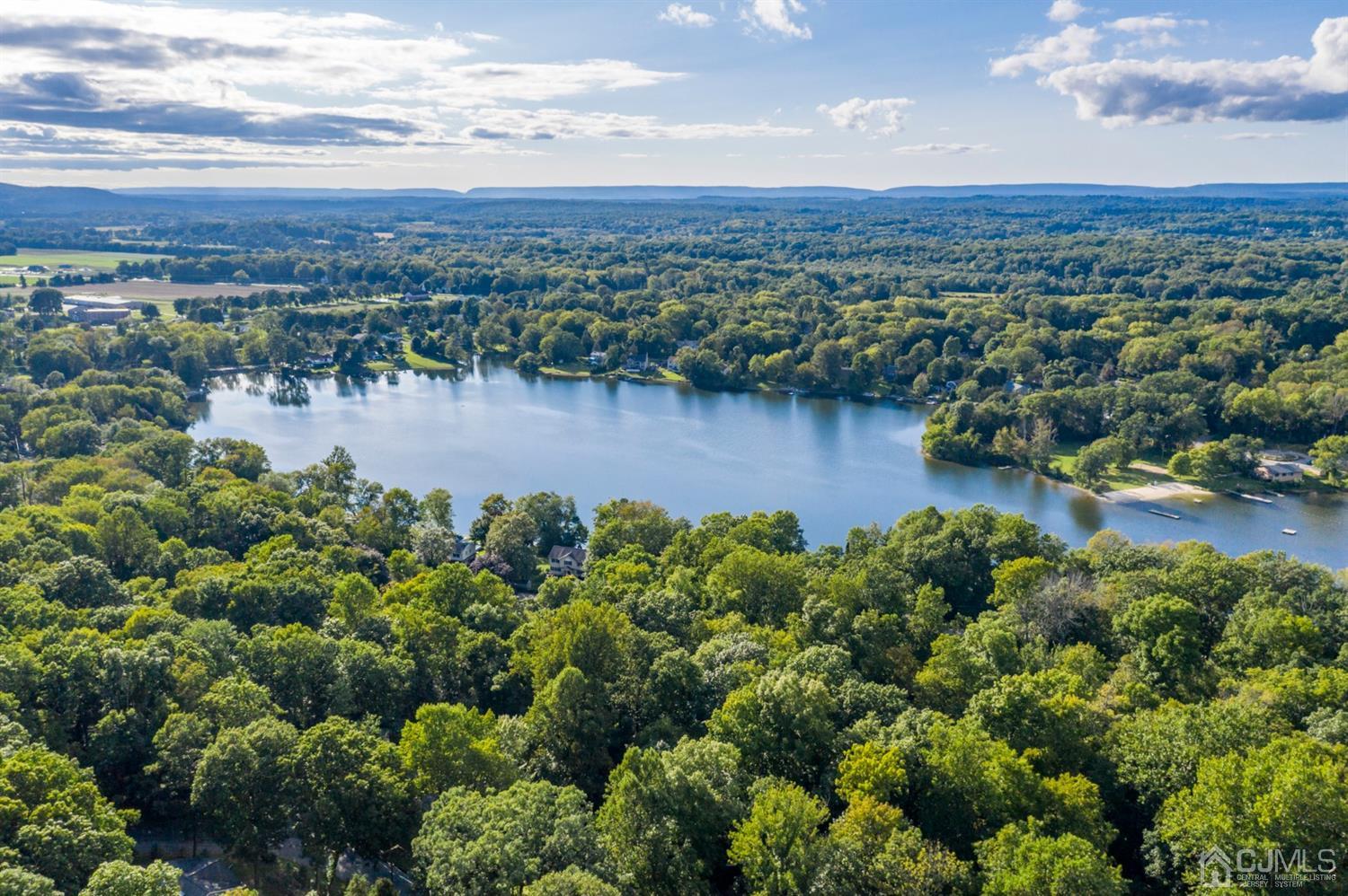 58 Forest Road Andover, NJ 07821 - Photo 31 of 34 a view of a lake with houses