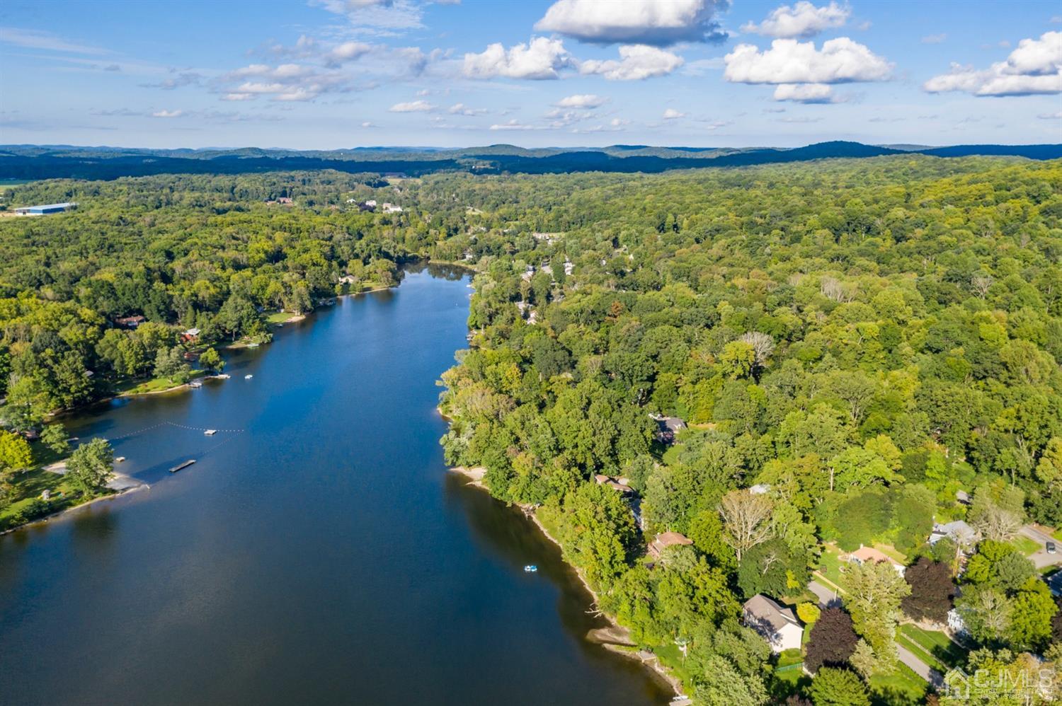 58 Forest Road Andover, NJ 07821 - Photo 34 of 34 a view of a lake with a mountain in the background