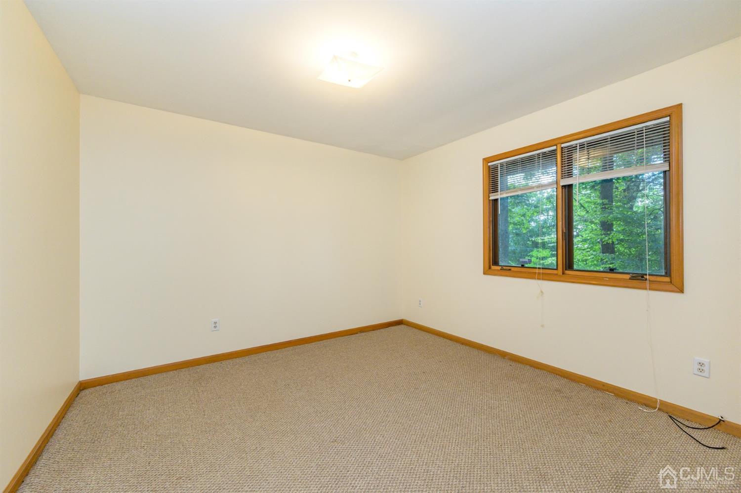 58 Forest Road Andover, NJ 07821 - Photo 7 of 34 an empty room with a window
