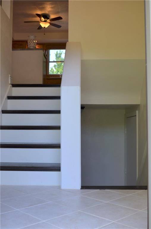 217 Cole Road Sarver, PA 16055 - Photo 13 of 14 Entry with newer wood stairs and porcelain flooring