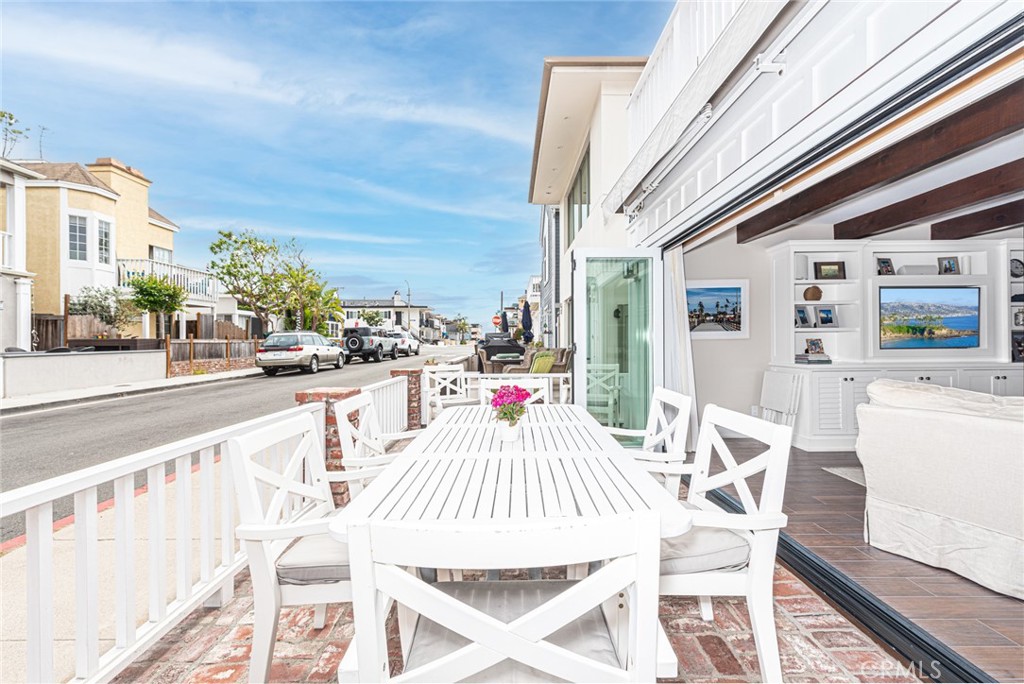 213 34th Street Newport Beach, CA 92663 - Photo 1 of 32 a view of a dining tables and chairs in the balcony