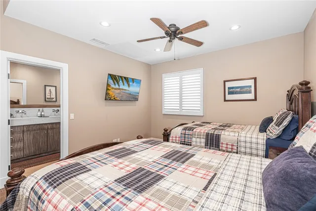 a bedroom with two beds and a window