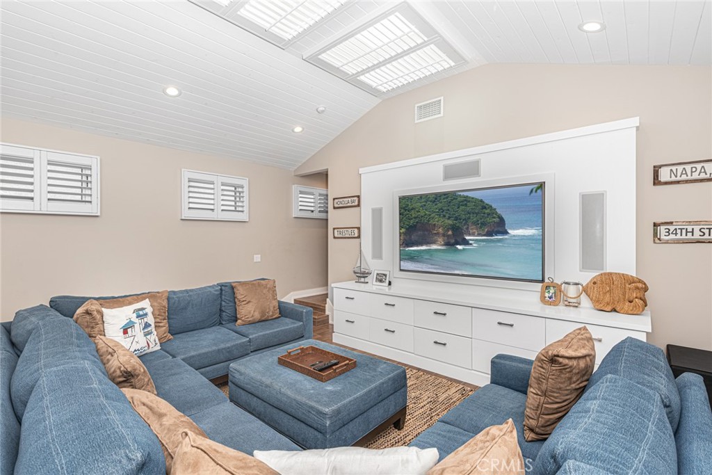 213 34th Street Newport Beach, CA 92663 - Photo 14 of 32 a living room with furniture and a flat screen tv