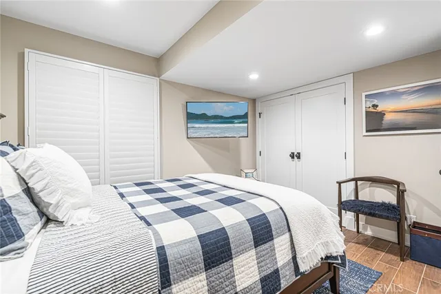 a bedroom with a bed and a lamp on table