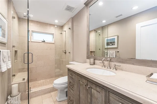 a large bed sitting in a bedroom next to a cabinet