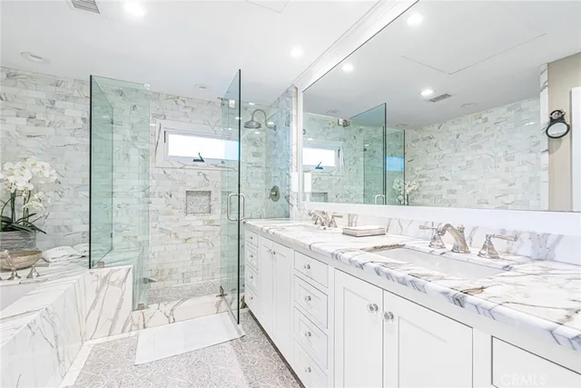 a bathroom with a sink and a shower