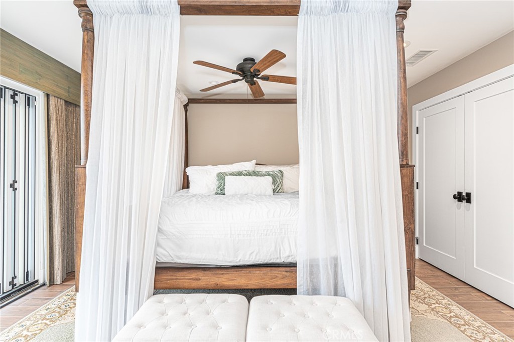 213 34th Street Newport Beach, CA 92663 - Photo 9 of 32 a bedroom with a bed and window