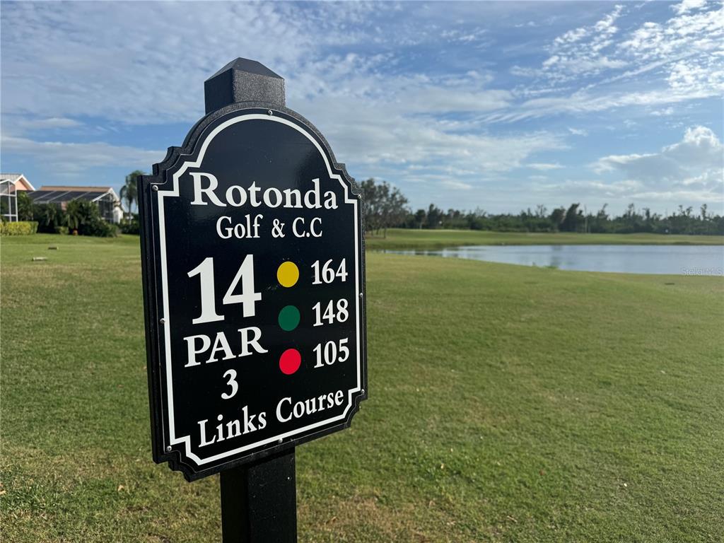 8 Windward Place Placida, FL 33946 - Photo 3 of 4 a view of a sign board with a lake view