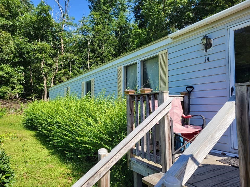 74 Old Turnpike Road Thompson, CT 06262 - Photo 11 of 18 a view of a house with pool and wooden fence