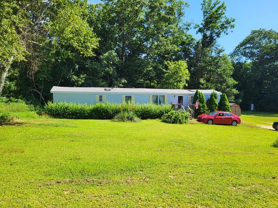 74 Old Turnpike Road Thompson, CT 06262 - Photo 2 of 18 a view of a garden and basketball court