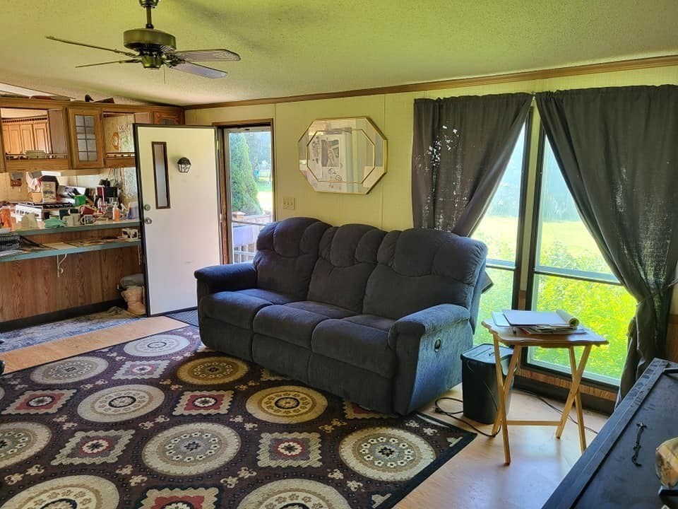 74 Old Turnpike Road Thompson, CT 06262 - Photo 3 of 18 a living room with furniture and a window