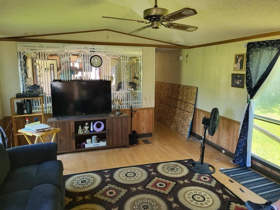 74 Old Turnpike Road Thompson, CT 06262 - Photo 6 of 18 a living room with furniture and a flat screen tv