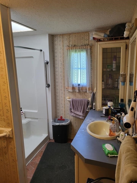 74 Old Turnpike Road Thompson, CT 06262 - Photo 9 of 18 a bathroom with a tub sink and mirror