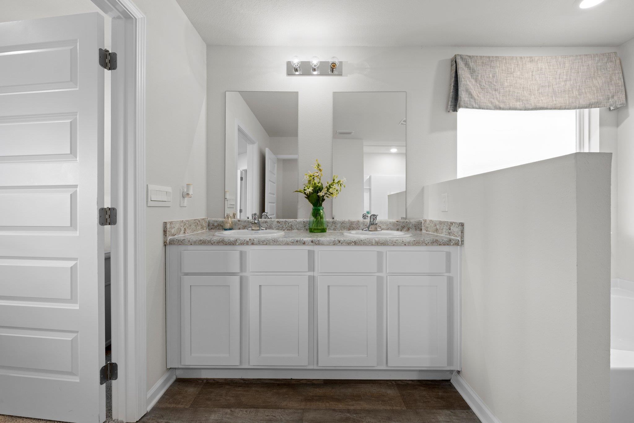 9747 Millee Loop Pensacola, FL 32526 - Photo 11 of 17 a bathroom with a granite countertop sink and a mirror