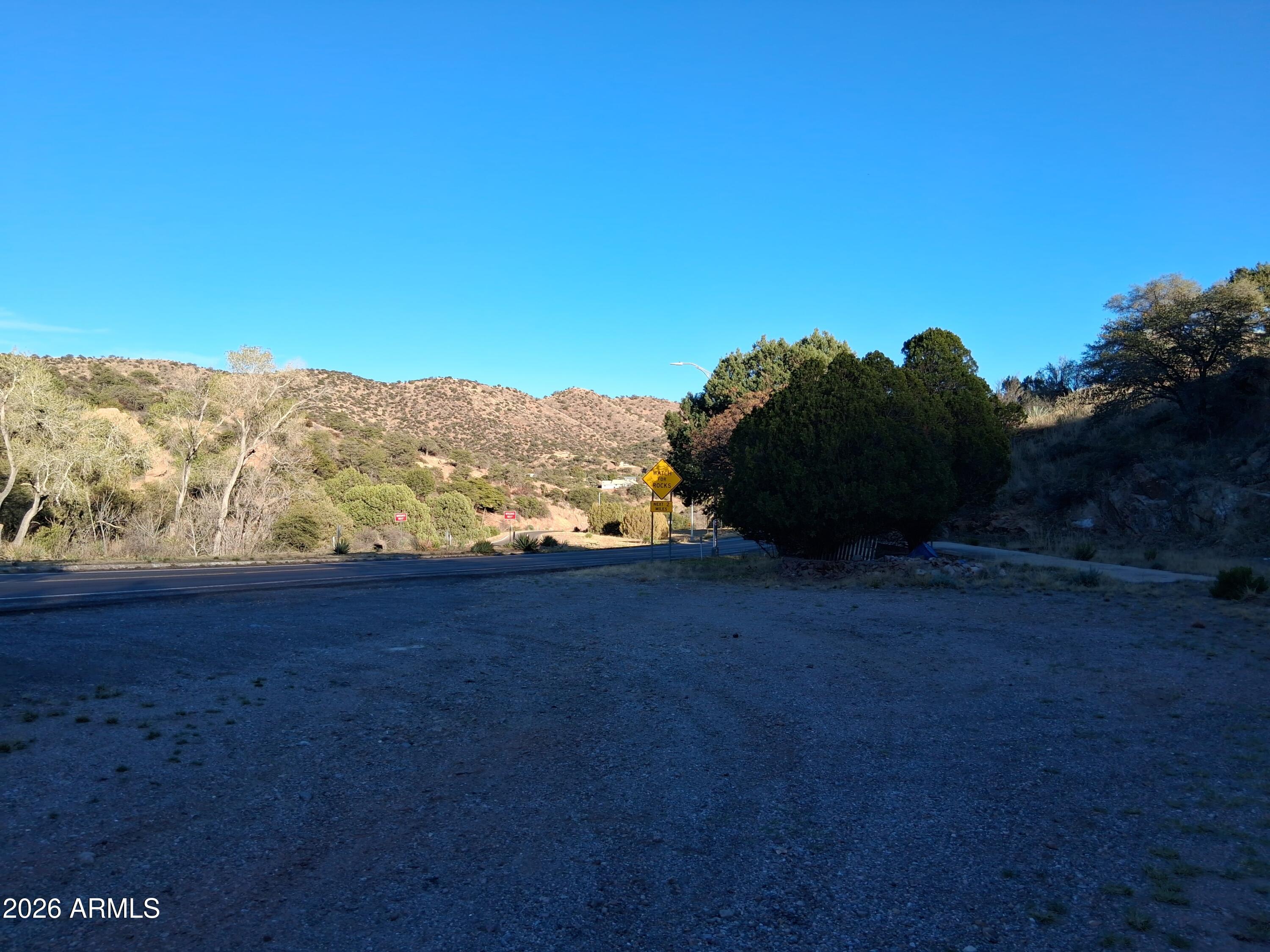 1589 Highway 80 Bisbee, AZ 85603 - Photo 16 of 18 a view of a large yard with an ocean