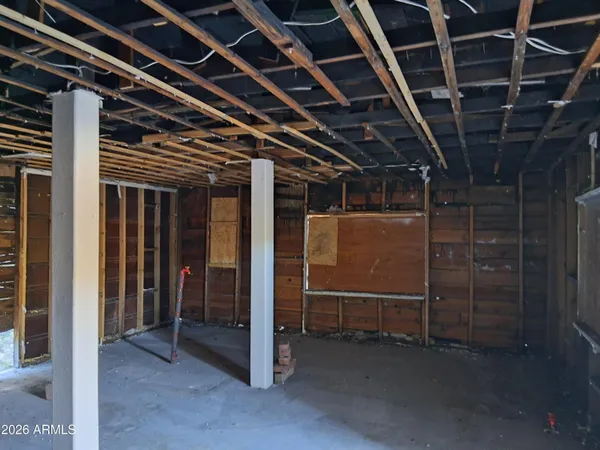 a view of an empty room with wooden walls