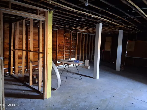 a view of a wooden fence next to a yard
