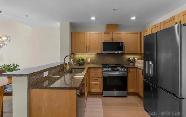a kitchen with a sink a stove and refrigerator