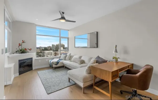 a living room with furniture and a large window