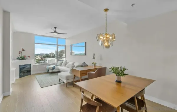a view of a dining room with furniture window and wooden floor
