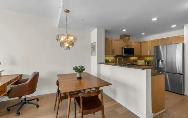 a kitchen with cabinets and stainless steel appliances